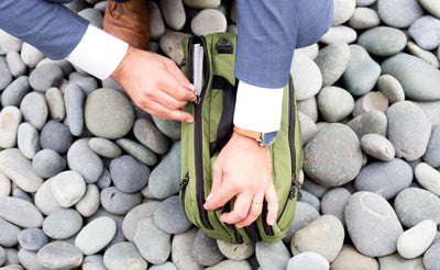 lifestyle visible^^A person opening the rear main compartment of The Stowaway.
