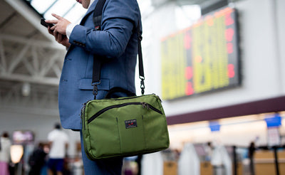 lifestyle visible^^A person carrying The Stowaway over their shoulder with the optional Absolute Shouler Strap.