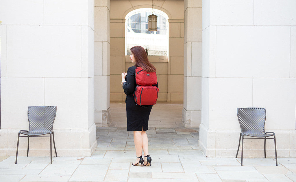 lifestyle visible^^A person carrying a Stowaway via backpack straps.