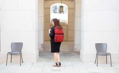 lifestyle visible^^A person carrying a Stowaway via backpack straps.