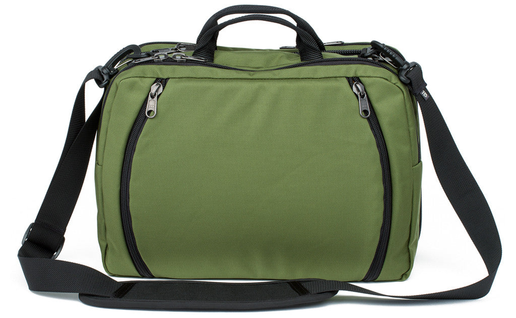 visible variant TB0975-OKYJ^^A reverse shot of The Stowaway in Olive (green) 525 Ballistic.