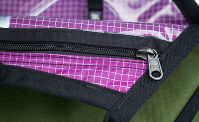 A close shot of the zippers on the clear urethane zippered pockets.