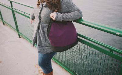 lifestyle visible^^A person on a ferry carrying the Swift over their shoulder.