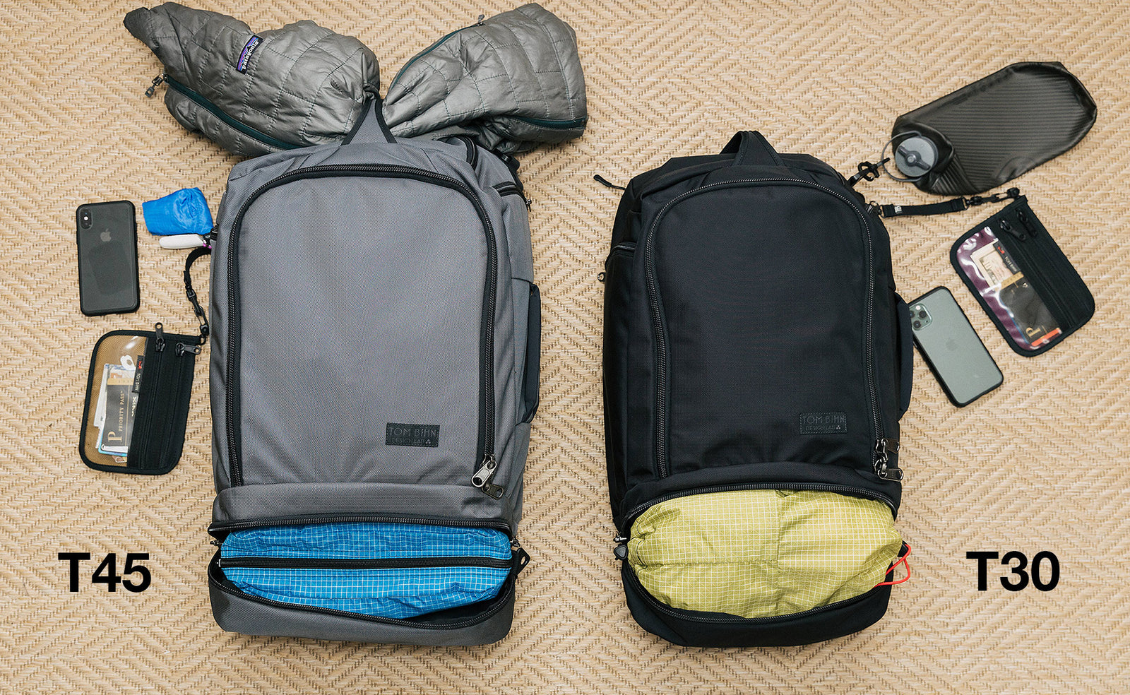 visible detail ^^ A comparison of what can fit in the Techonauts. The Techonaut 45 (left) has a puffy coat stowed in the top grab handle and a Packing Cube in it's bottom pocket. The Techonaut 30 (right) has a Aeronaut 30 Travel Stuff Sack in its bottom pocket.