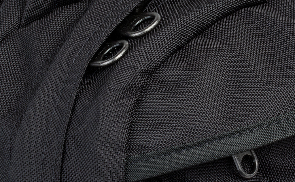 detail visible^^A close shot of the zipper pulls under the zipper flap.