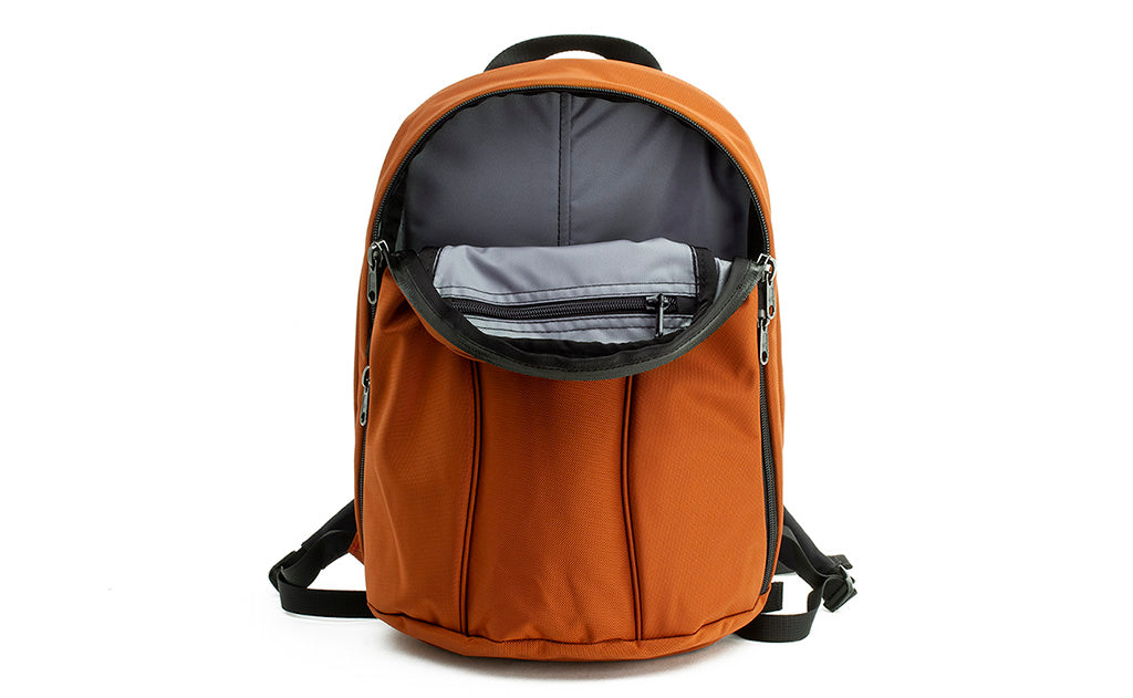 visible variant TB0107-TKLJ^^The Luminary 12 in Burnt Orange 525 Ballistic with a Cloud (light grey) 210 Ballistic interior.