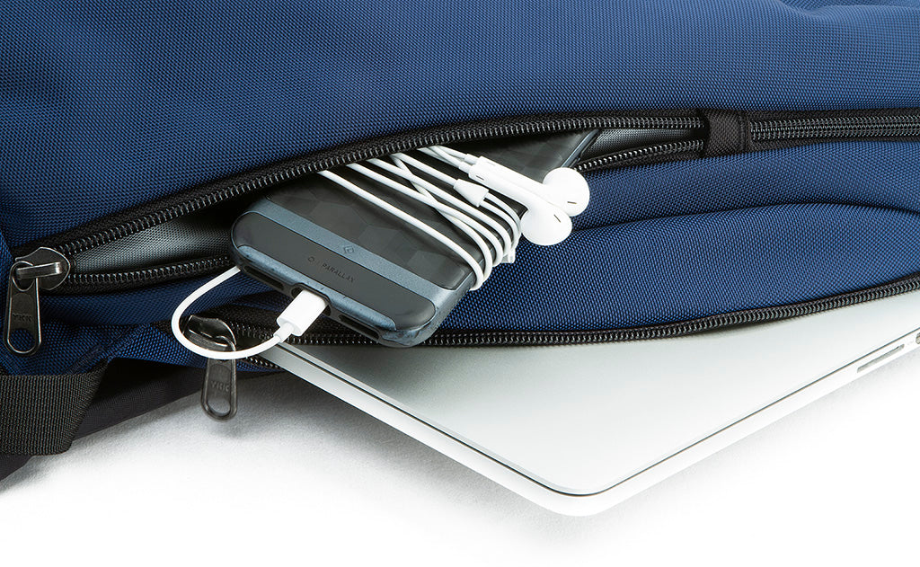 detail visible^^A small laptop in the padded pocket of the Luminary 12 and a phone in the small side pocket of the Luminary 12.