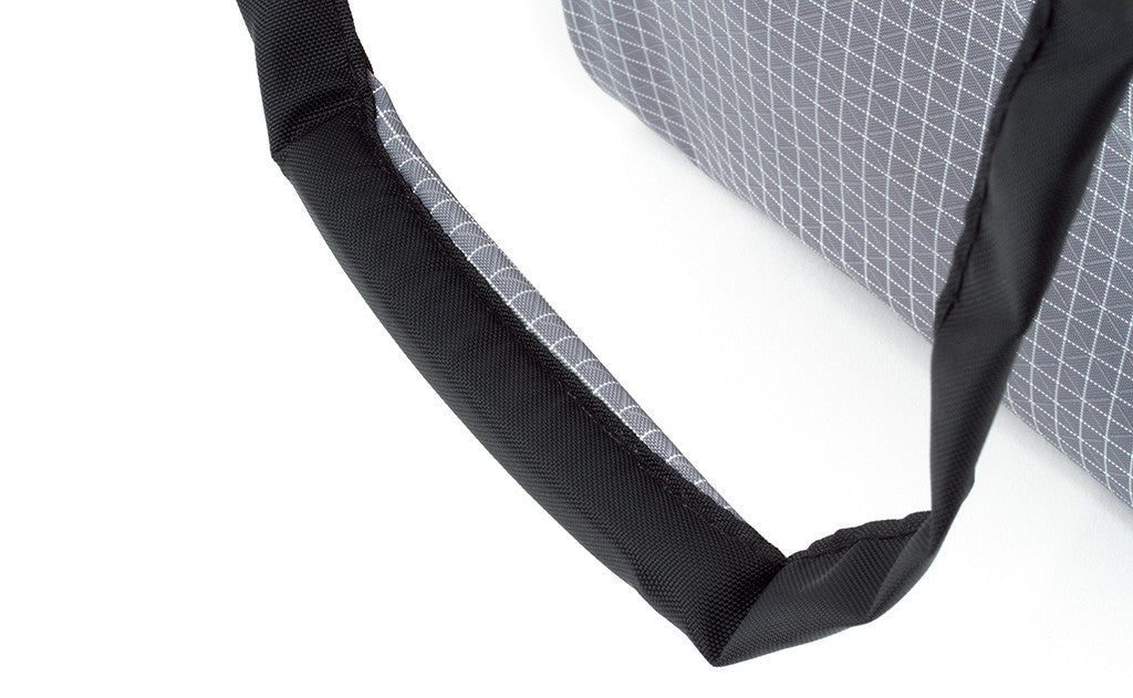visible detail^^A close shot of a padded handle on the Original Large Shop Bag.