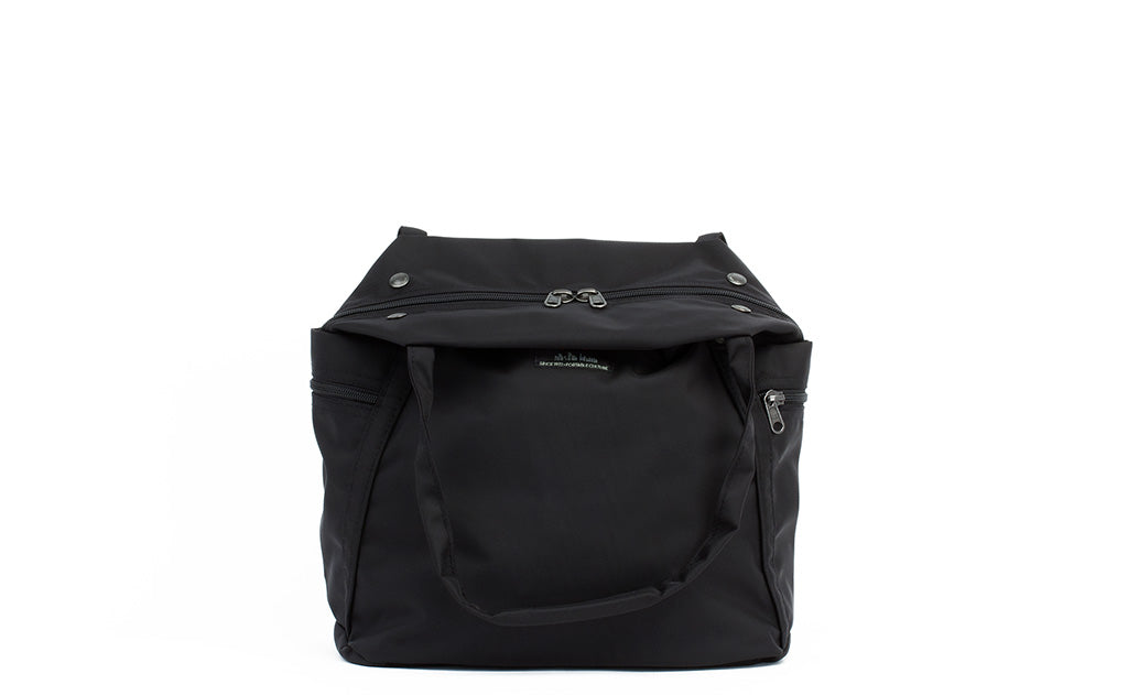 detail visible^^The Pop Tote with its handles folded down.