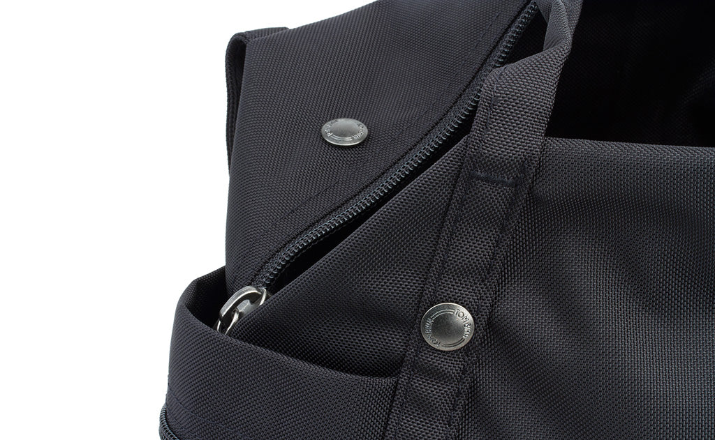 detail visible^^A close shot of the metal snaps and zipper on the Pop Tote.