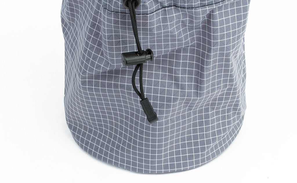 visible detail^^The pull string and compressing closure clip of the Yarn Stuff Sack, this one in Northwest Sky (light grey with white grid) 200 Halcyon.