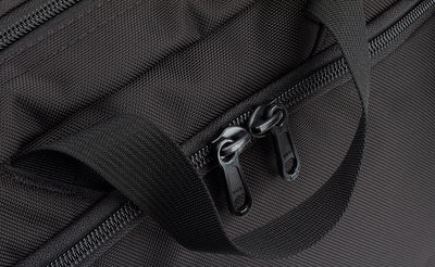 detail visible^^A close shot of the nylon carry handle and the front zippered compartment