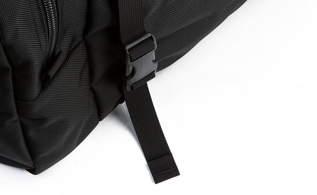 visible detail^^An close shot of the lash strap buckle on the Road Buddy Duffel 