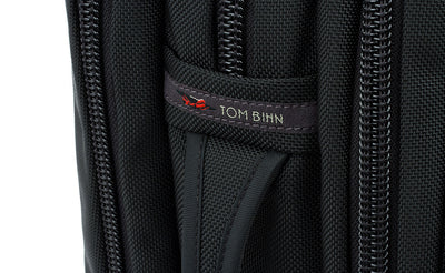 detail visible^^A close shot of the side grab handle and the TOM BIHN tag.