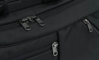 detail visible^^A close shot of the regular zippers of the front pockets and locking zippers on the main compartment of the Western Flyer.