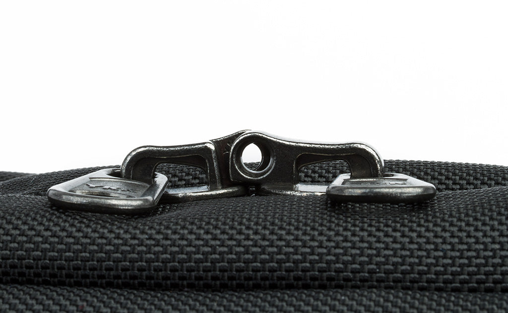 detail visible^^The locking zippers on a Black 525 Ballistic Western Flyer zipped shut to show the individual openings on each of the two zippers pairing together to create a slot for a travel lock.