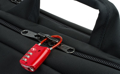 detail visible^^The locking zippers on a Black 525 Ballistic Western Flyer zipped shut and locked with a travel lock.