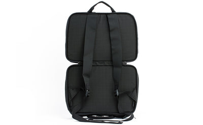 visible variant TB0975-BHND^^A side-on shot of A shot of the face of The Stowaway in Black (black with grey grid) 400 Halcyon with the main compartment open to access the backpack straps.