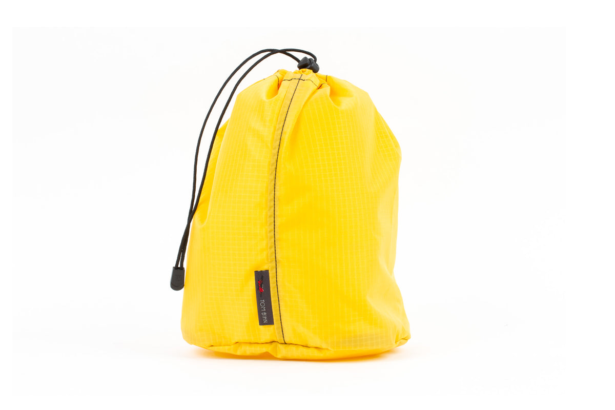 visible variant TB1254-RL^^A Size 4 Marigold (yellow with light yellow grid) 210 Cerylon Travel Stuff Sack.