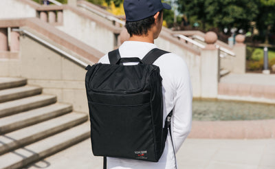 lifestyle visible^^Person carrying the Cambiata with backpack straps.