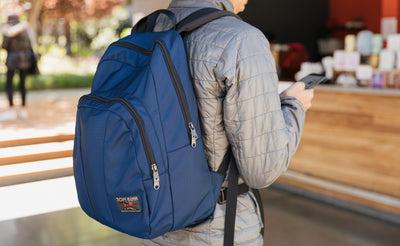 lifestyle visible^^A person in line at a cafe wearing a Deep Blue Paramour. 