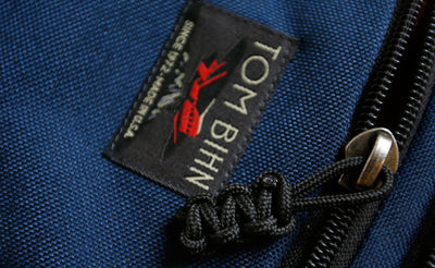 visible variant TB0512C-BA^^Cord Zipper Pulls knotted and attached to a bag's zipper sliders directly