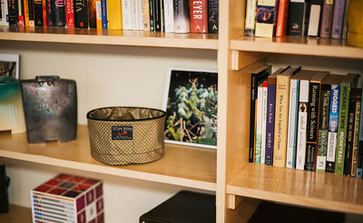 lifestyle visible^^A Large Travel Tray on a book shelf