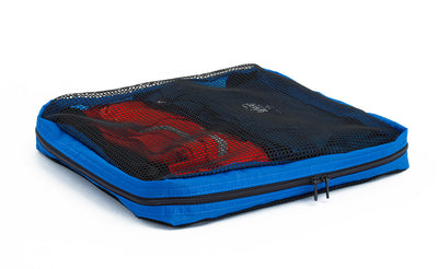 visible variant TB94002-LE^^A full, closed Medium Tri-Star Packing Cube in Island (blue) 120 Aether.