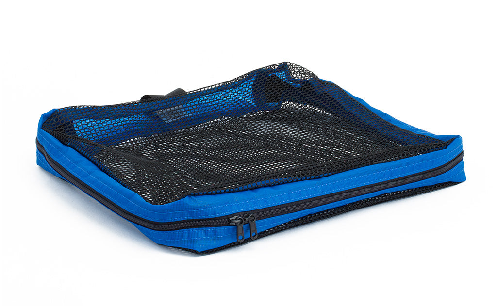 visible variant TB94002-LE^^An empty, closed Medium Tri-Star Packing Cube in Island (blue) 120 Aether.