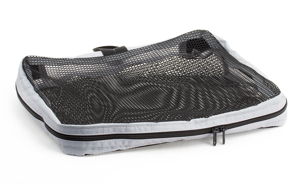 visible variant TB94002-NE^^An empty, closed Medium Tri-Star Packing Cube in Northwest Sky (light grey) 120 Aether.