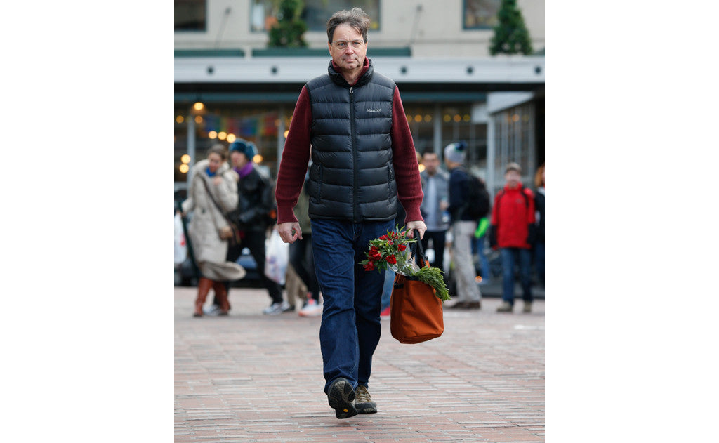 lifestyle visible^^A person carrying a filled Moveable Feast down a street.