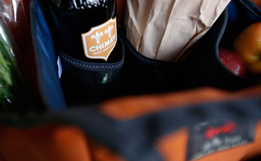 lifestyle visible^^A Moveable Feast holding beer and fruit.