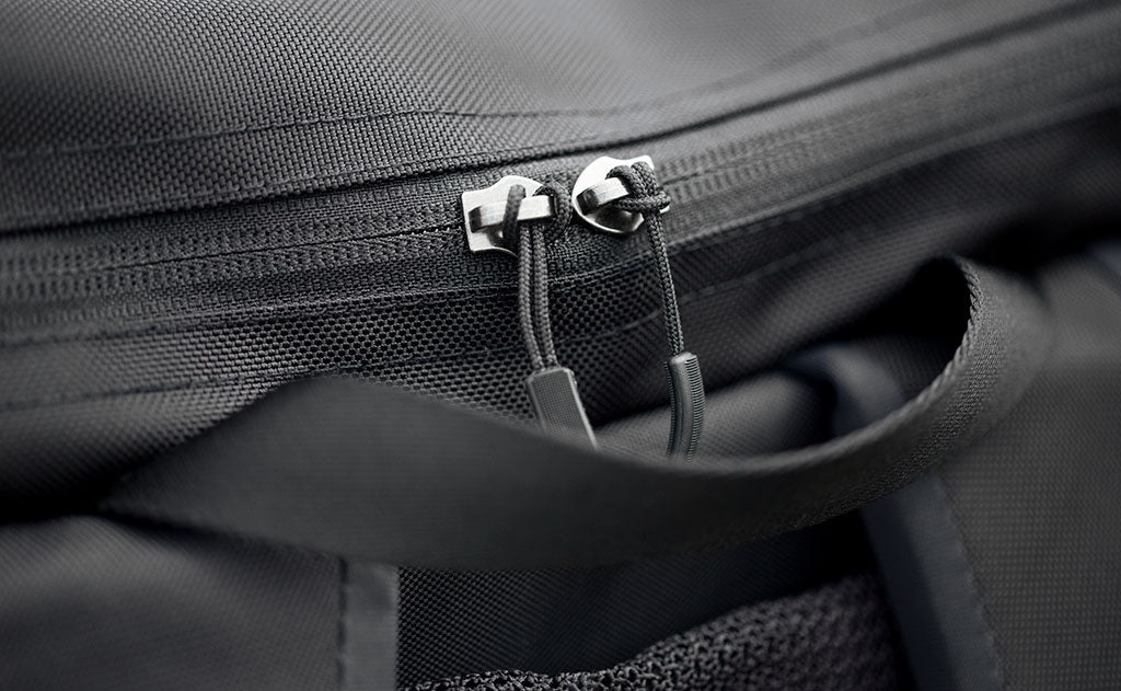 visible detail^^Close-up of the top pocket zipper on the Shadow Guide; we've cut the metal pulls off and have replaced them with cord pulls so you don't have to.