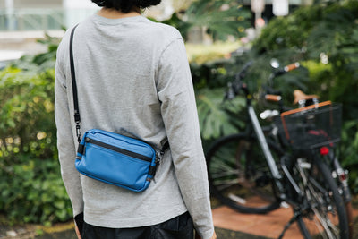 lifestyle visible^^Person wearing a Side Effect as a crossbody bag.