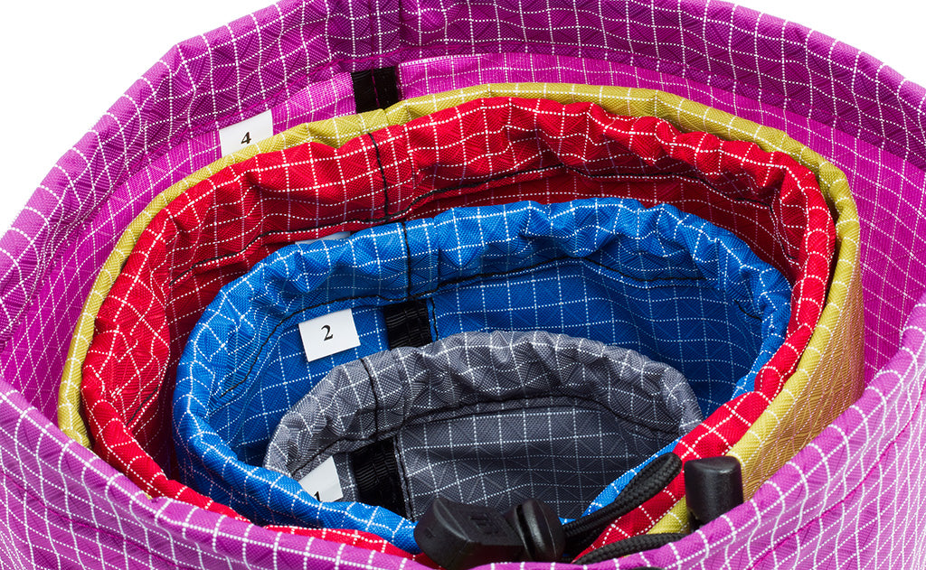 detail visible^^All 4 sizes of Travel Stuff Sack, each seated in the size higher numbered size (i.e. a size 4 holding a size 3 holding a size 2 holding a size 1).