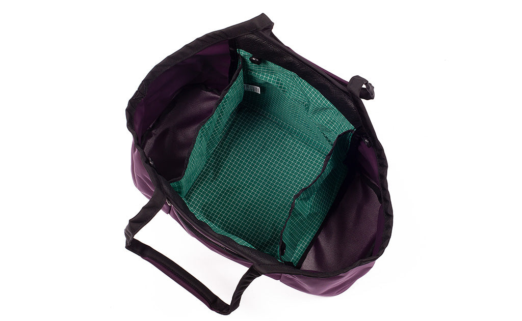 visible variant TB0619-UKKD^^Truckasana in Aubergine purple/Sitka green. Top down view shows the empty three main compartments of the bag.