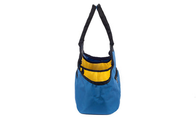visible variant TB0619-NKOD^^The Truckasana in Constellation blue/Solaris yellow. Side view of the bag.