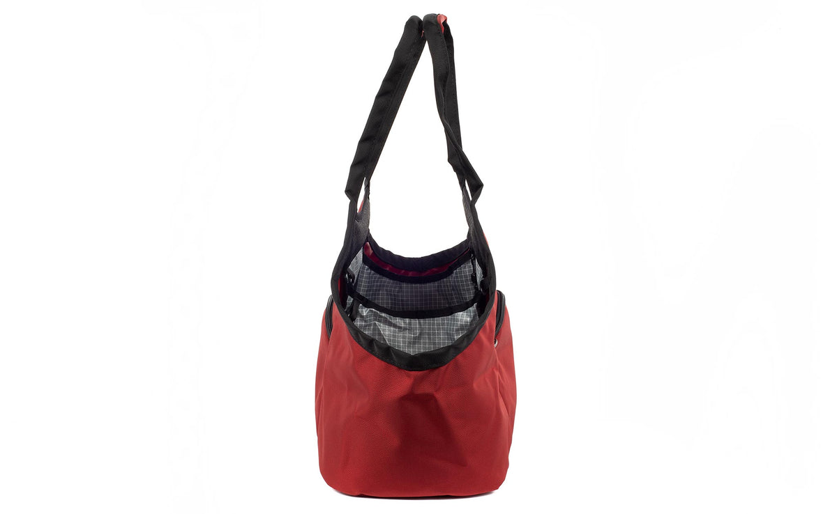 visible variant TB0619-MKND^^The Truckasana in Mars Red 525d Ballistic and Northwest Sky 200d grey lining. Side view of the bag.
