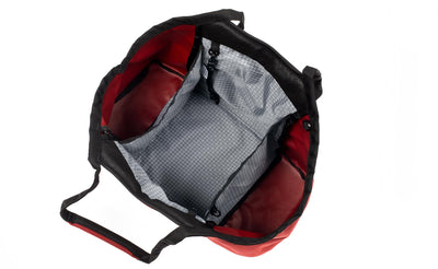 visible variant TB0619-MKND^^The Truckasana in Mars Red 525 Ballistic with Northwest Sky 200d Halcyon grey lining. Top-down photo shows the empty three main compartments of the bag.