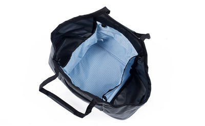 visible variant TB0619-GKAD^^The Truckasana in Nebulous grey/Acuity blue. Top-down photo shows the empty bag with its three compartments.