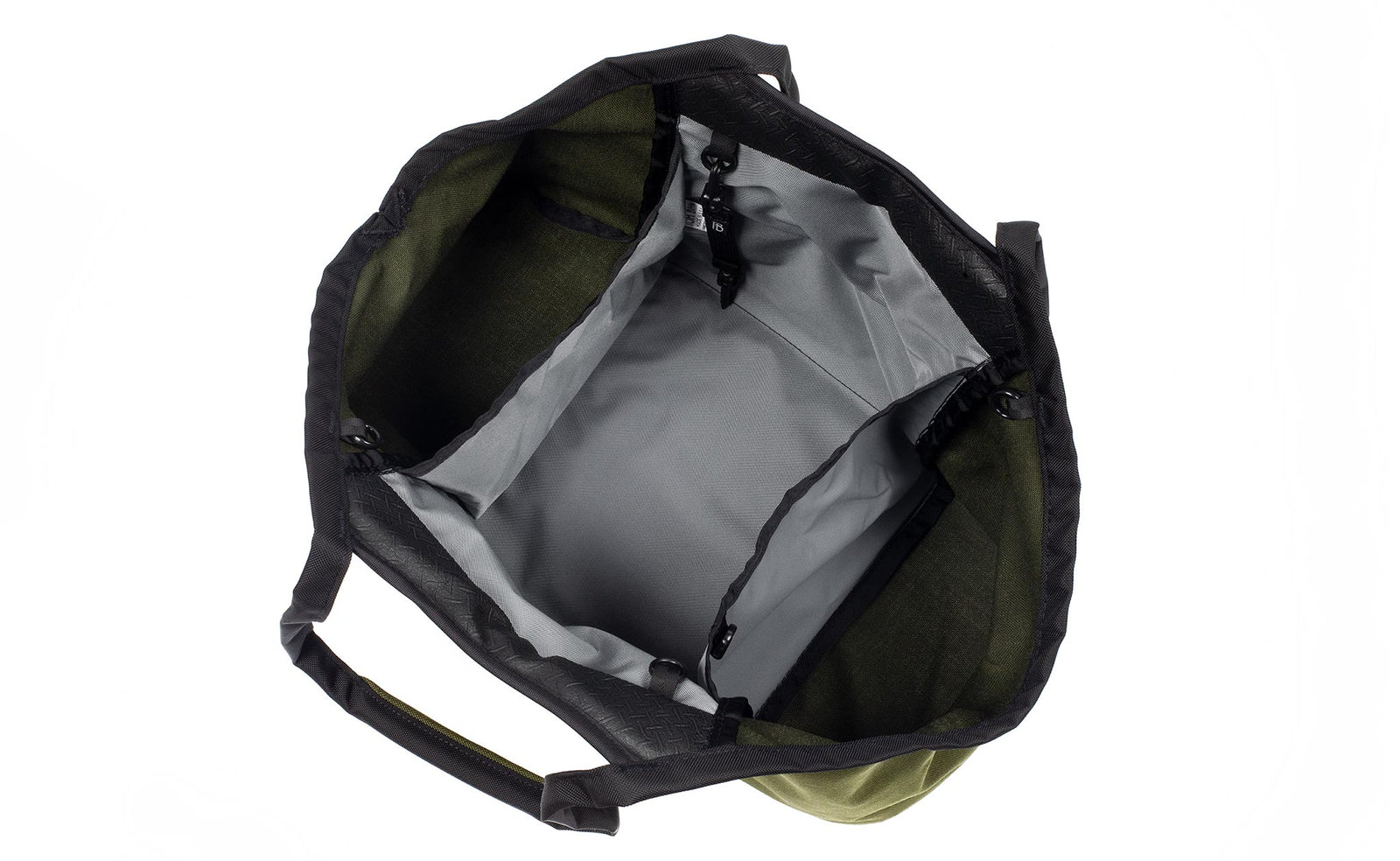 visible variant TB0619-OCLJ^^The Truckasana in Olive green 1000d Cordura with Cloud grey lining. Top-down photo shows the empty three main compartments of the bag.