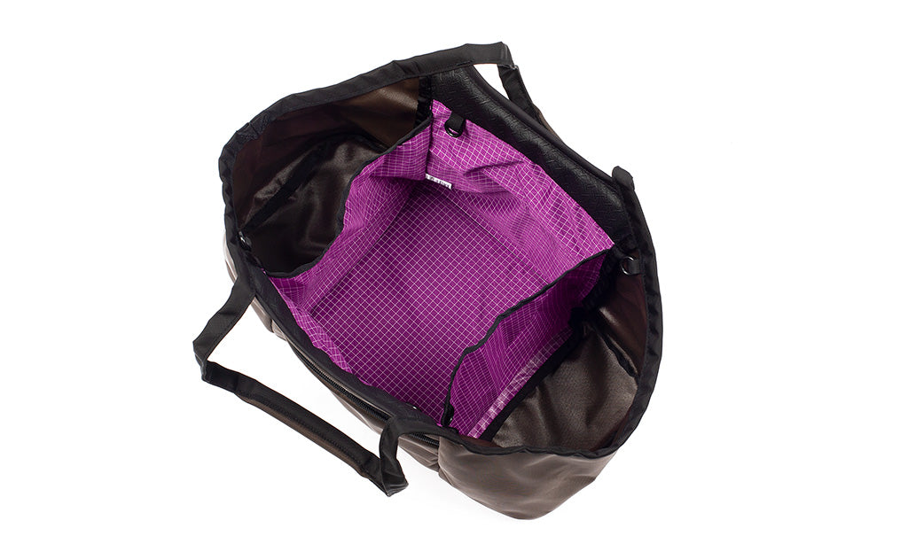 visible variant TB0619-RKUD^^The Truckasana in Ursa brown/Ultraviolet purple. Top-down photo shows the empty three main compartments of the bag.