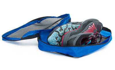 visible variant TB95200-LE^^An open Large Western Flyer Packing Cube in Island (blue) 120 Aether filled with a pair of shoes.