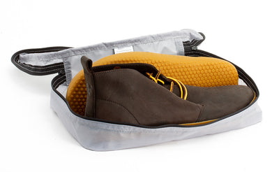 visible variant TB95200-NE^^An open Large Western Flyer Packing Cube in Northwest Sky (light grey) 120 Aether filled with a pair of shoes.