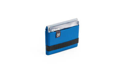 visible variant TB1277-IJ^^The Size 1 Nik's Minimalist Wallet in Island (blue) 210 Ballistic closed pockets-out with the attached elastic band.