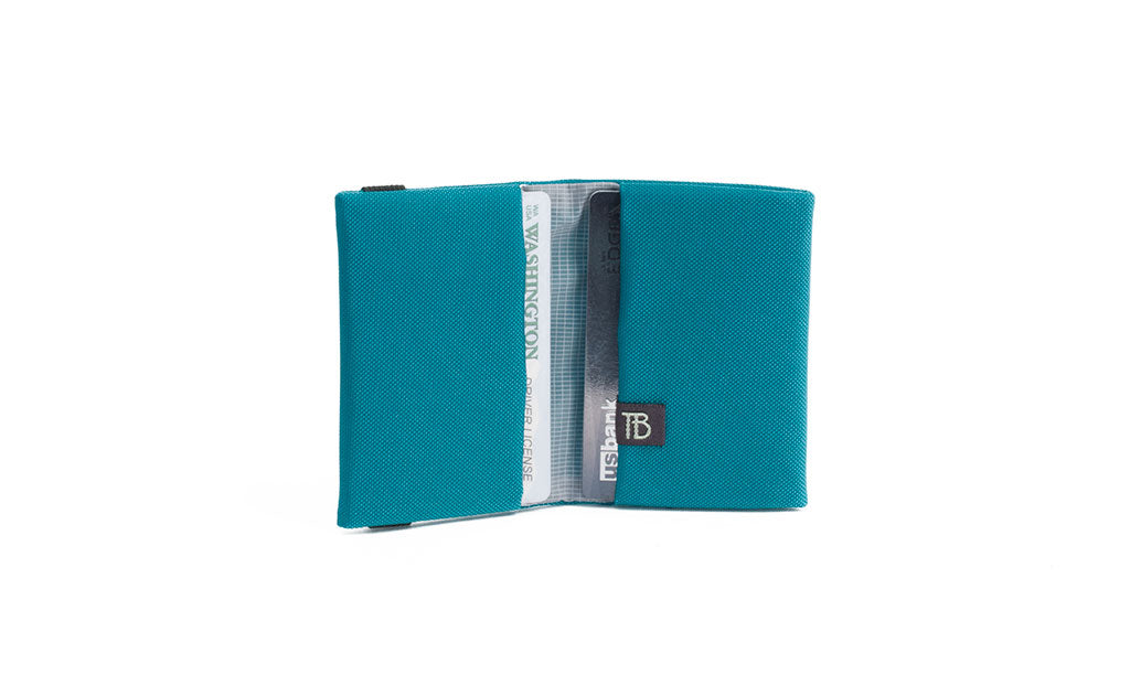 visible variant TB1277-VJ^^The Size 1 Nik's Minimalist Wallet in Viridian (blue-green) 210 Ballistic.