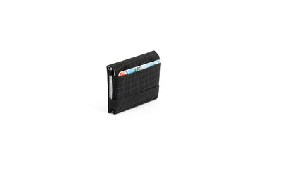 visible variant TB1279-BH^^The Size 3 Nik's Minimalist Wallet in Black (black with grey grid) 400 Halcyon closed with the attached elastic band.