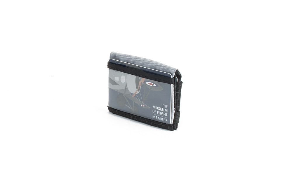 visible variant TB1279-BH^^The Size 3 Nik's Minimalist Wallet in Black (black with grey grid) 400 Halcyon closed interior pockets-out with the attached elastic band.