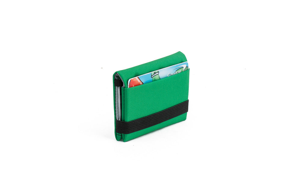 visible variant TB1279-GJ^^The Size 3 Nik's Minimalist Wallet in Grass (bright green) 210 Ballistic closed with the attached elastic band.