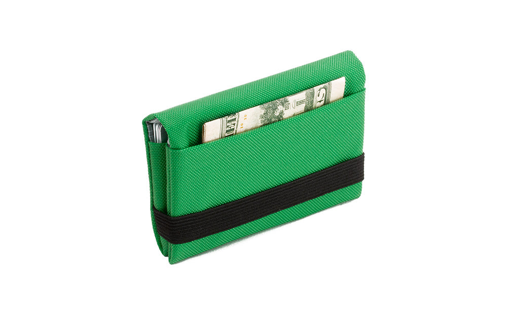 visible variant TB1275-GJ^^The Size 5 Nik's Minimalist Wallet in Grass (bright green) 210 Ballistic closed with the attached elastic band.